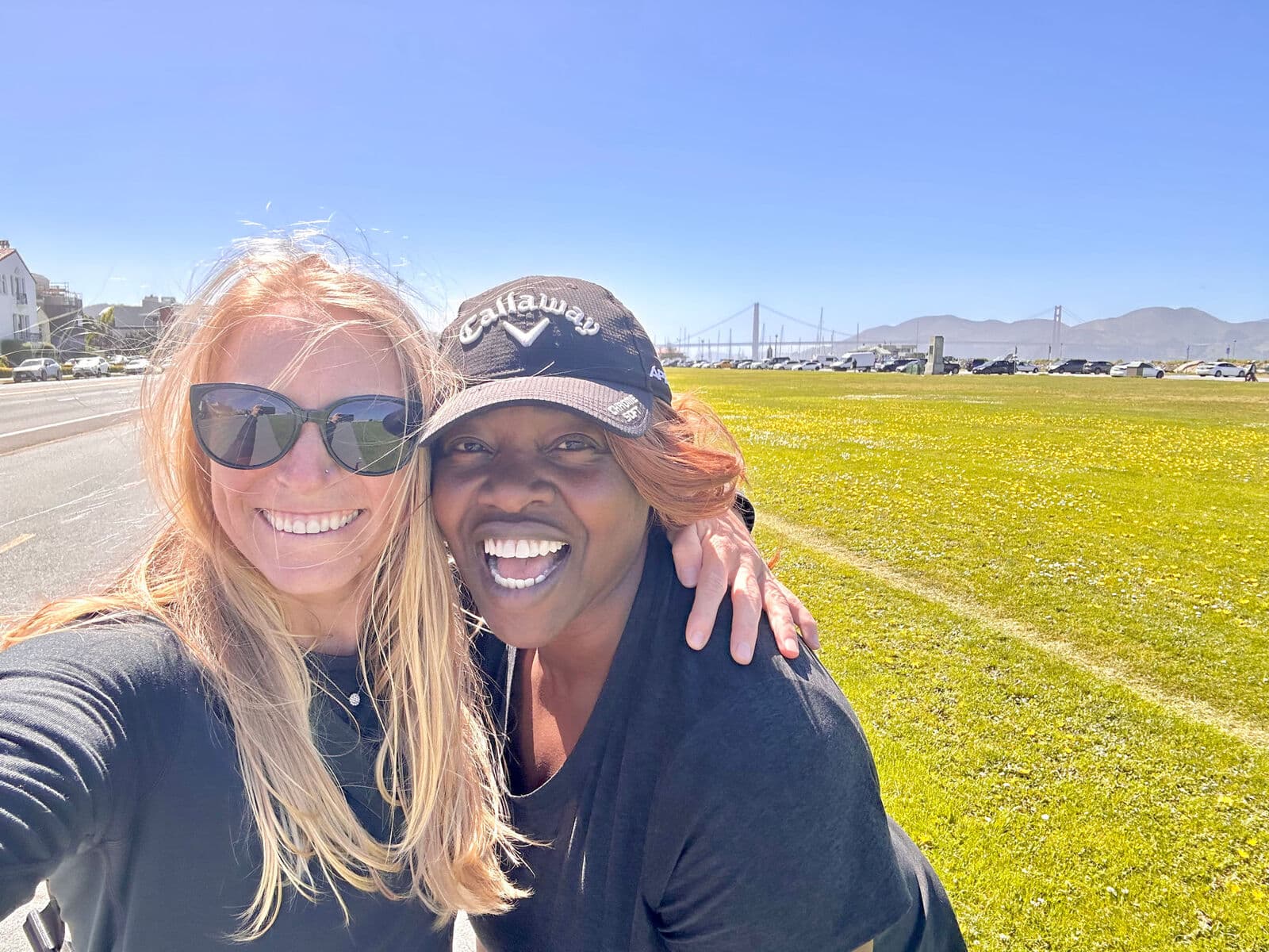MatchUP co-founders standing together on a grass field