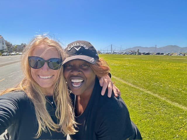 MatchUP co-founders standing together on a grass field