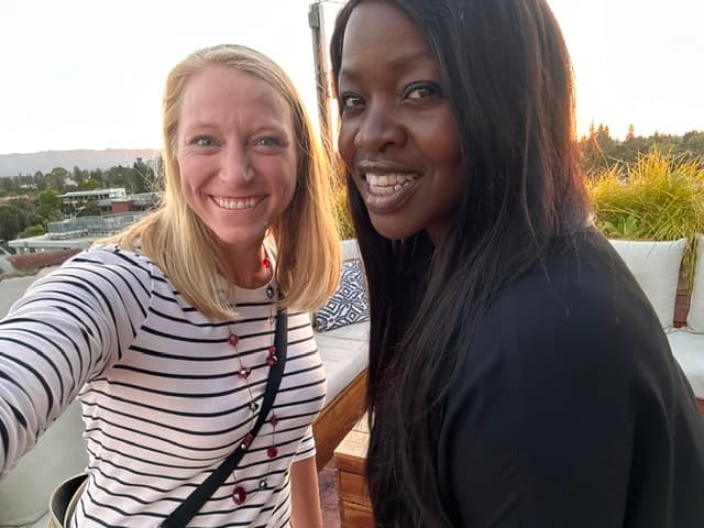 MatchUP co-founders Catt and Katie together on a rooftop at golden hour